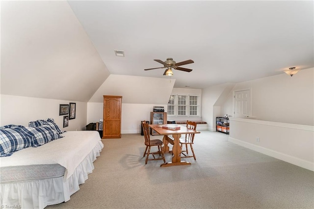 carpeted bedroom with lofted ceiling and ceiling fan