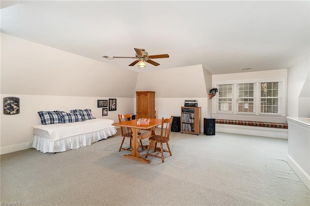 carpeted bedroom with lofted ceiling and ceiling fan