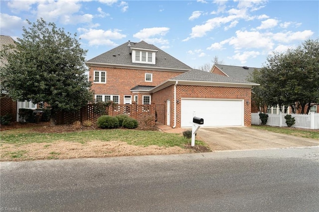 view of front property with a garage and a front lawn