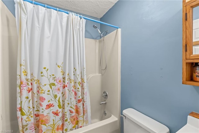 bathroom with a textured ceiling, toilet, and shower / bathtub combination with curtain