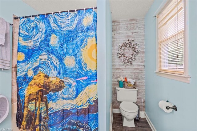 bathroom with toilet, vanity, a textured ceiling, wood-type flooring, and cooling unit