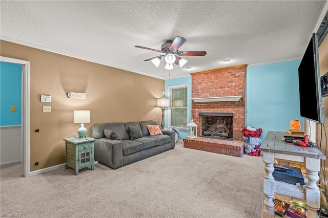 carpeted living room featuring a fireplace, a textured ceiling, ornamental molding, and ceiling fan