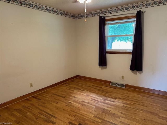 5912 US Highway 21, Jonesville, NC 28642 - unfurnished room with wood finished floors and baseboards