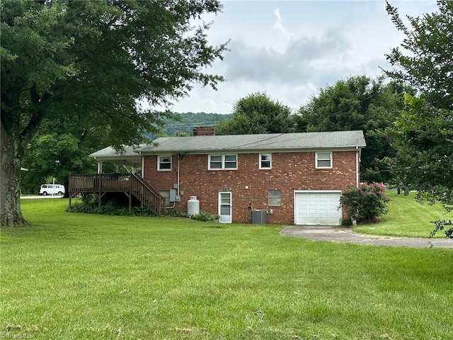 5912 US Highway 21, Jonesville, NC 28642 - back of house featuring stairs, an attached garage, a chimney, driveway, and brick siding