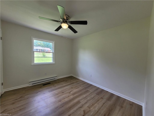 133 Lori Ln, Mount Airy, NC 27030 - unfurnished room with a baseboard heating unit, wood finished floors, and ceiling fan