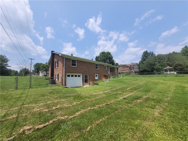 133 Lori Ln, Mount Airy, NC 27030 - rear view of property featuring brick siding, a garage, and driveway