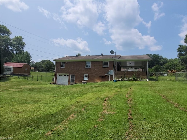133 Lori Ln, Mount Airy, NC 27030 - rear view of property with an attached garage, brick siding, and driveway