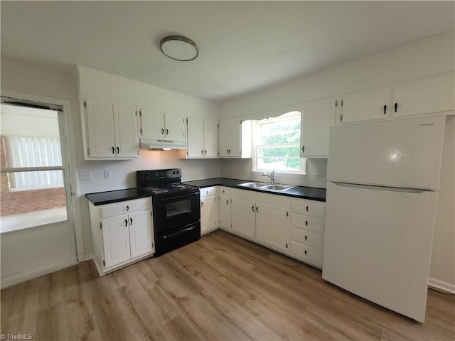 133 Lori Ln, Mount Airy, NC 27030 - kitchen with freestanding refrigerator, black range with electric stovetop, dark countertops, and white cabinets