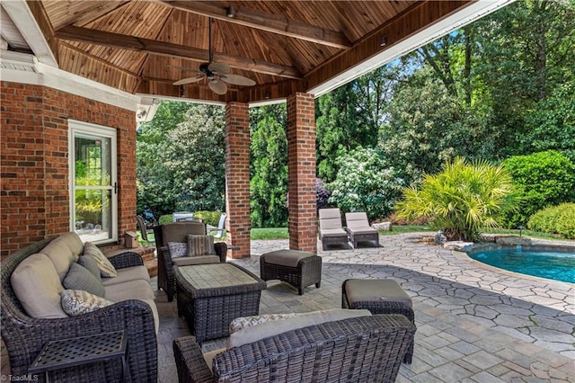 view of patio / terrace with a ceiling fan, an outdoor hangout area, and an outdoor pool
