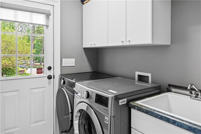laundry area with cabinet space and washing machine and dryer