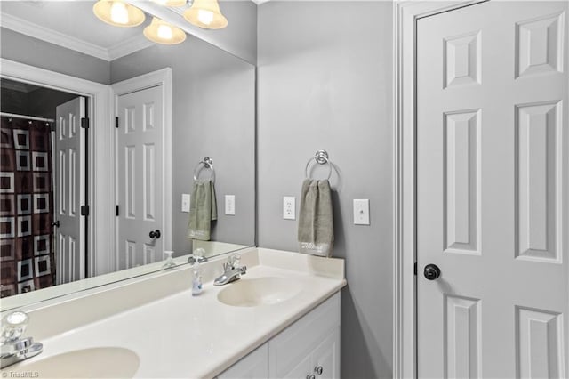 bathroom featuring double vanity and crown molding