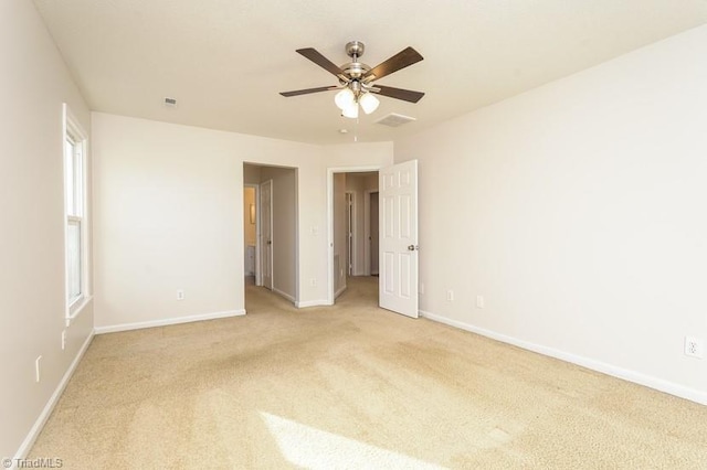 carpeted empty room with ceiling fan