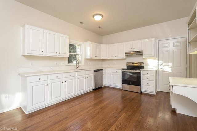 kitchen with white cabinetry, sink, dark hardwood / wood-style floors, and appliances with stainless steel finishes