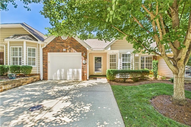 9 Whitdale Pt, Greensboro, NC 27455 - single story home featuring driveway, an attached garage, and brick siding
