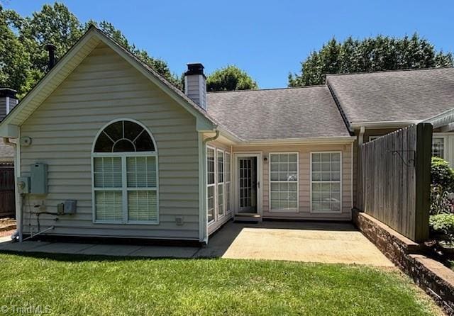 9 Whitdale Pt, Greensboro, NC 27455 - rear view of property with a chimney and a patio area