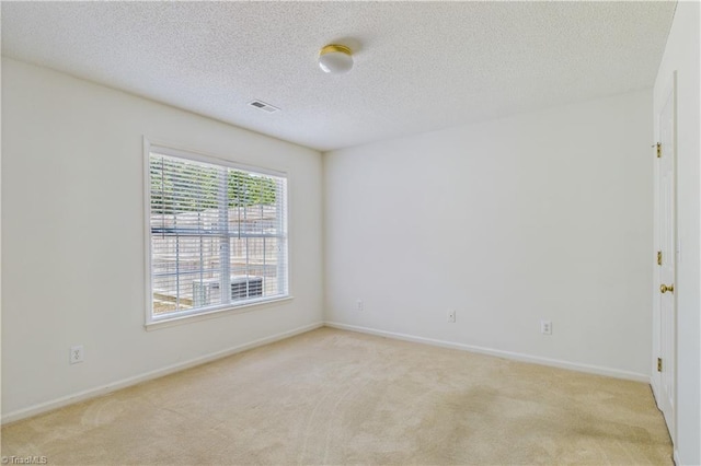 9 Whitdale Pt, Greensboro, NC 27455 - unfurnished room featuring light colored carpet and a textured ceiling