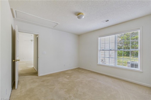 9 Whitdale Pt, Greensboro, NC 27455 - unfurnished room featuring attic access, light carpet, and a textured ceiling
