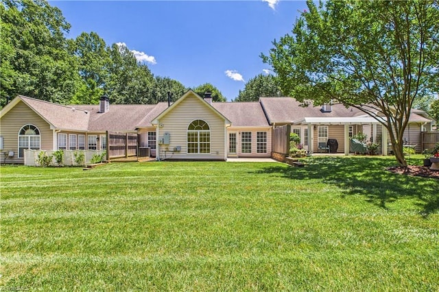 9 Whitdale Pt, Greensboro, NC 27455 - back of property featuring a lawn and a chimney