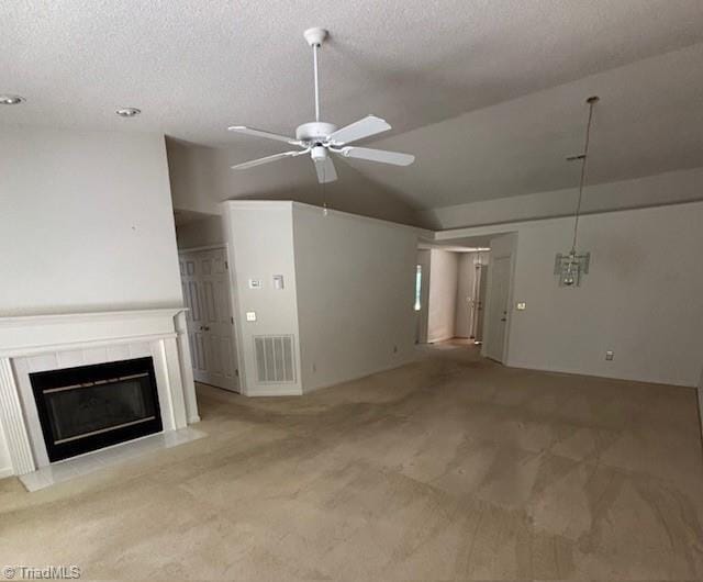 9 Whitdale Pt, Greensboro, NC 27455 - unfurnished living room featuring vaulted ceiling, carpet, a textured ceiling, a ceiling fan, and a fireplace