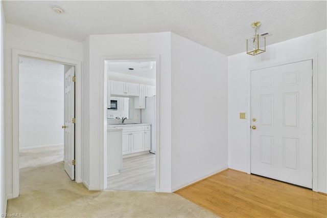 9 Whitdale Pt, Greensboro, NC 27455 - entryway with light carpet and baseboards