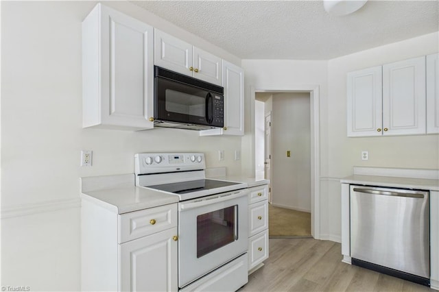 9 Whitdale Pt, Greensboro, NC 27455 - kitchen with black microwave, white electric range oven, dishwasher, white cabinetry, and a textured ceiling