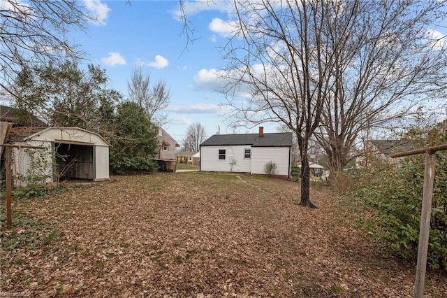 view of yard featuring an outbuilding and a storage unit