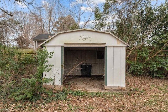 view of shed with fence