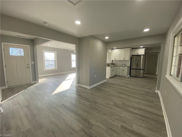 unfurnished living room featuring hardwood / wood-style flooring