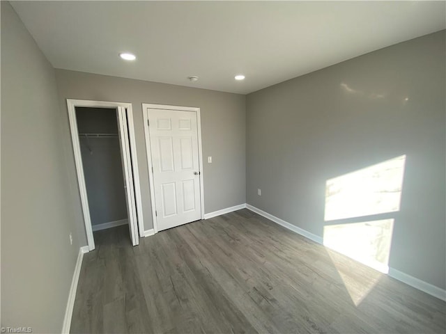 unfurnished bedroom featuring dark hardwood / wood-style floors