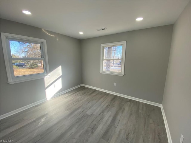 empty room with hardwood / wood-style floors