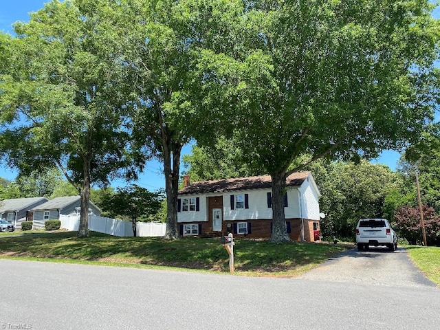 7533 Greenmeadow Dr, Tobaccoville, NC 27050 - split foyer home with brick siding and asphalt driveway
