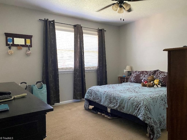 7533 Greenmeadow Dr, Tobaccoville, NC 27050 - bedroom with light colored carpet, ceiling fan, and a textured ceiling