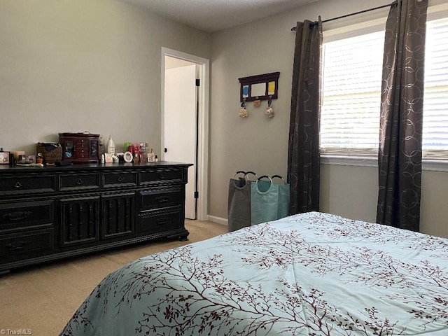 7533 Greenmeadow Dr, Tobaccoville, NC 27050 - bedroom featuring light colored carpet