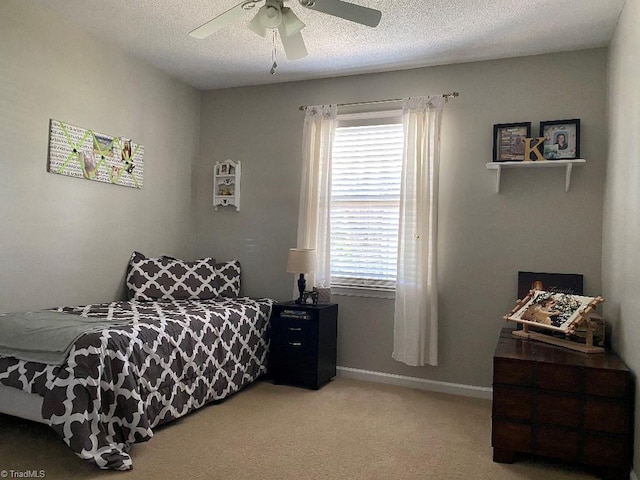 7533 Greenmeadow Dr, Tobaccoville, NC 27050 - bedroom with light colored carpet, a ceiling fan, baseboards, and a textured ceiling