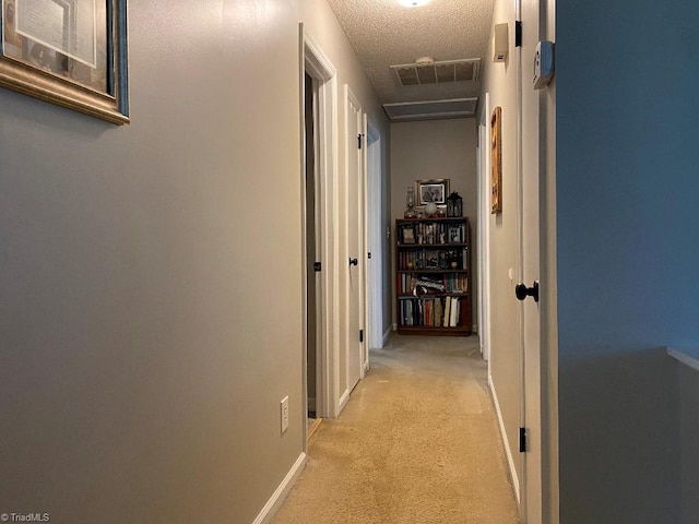 7533 Greenmeadow Dr, Tobaccoville, NC 27050 - hall with light carpet, a textured ceiling, and baseboards