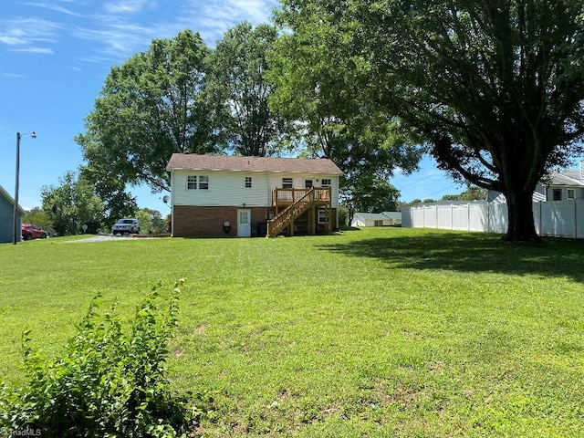 7533 Greenmeadow Dr, Tobaccoville, NC 27050 - view of yard with stairs and a deck