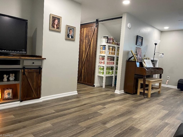 7533 Greenmeadow Dr, Tobaccoville, NC 27050 - office featuring a barn door, baseboards, wood finished floors, and recessed lighting