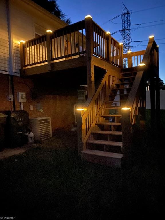 7533 Greenmeadow Dr, Tobaccoville, NC 27050 - back of house featuring stairway and cooling unit