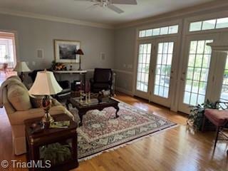 105 Finborough Ct, Kernersville, NC 27284 - living area featuring ornamental molding, wood finished floors, and ceiling fan