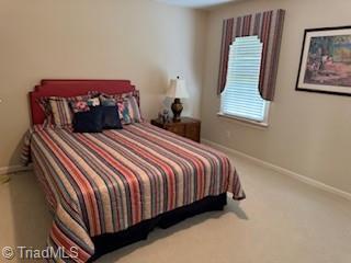105 Finborough Ct, Kernersville, NC 27284 - carpeted bedroom featuring baseboards