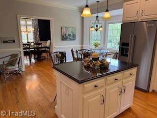 105 Finborough Ct, Kernersville, NC 27284 - kitchen featuring dark countertops, light wood-style floors, a chandelier, and stainless steel fridge with ice dispenser