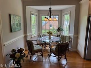 105 Finborough Ct, Kernersville, NC 27284 - dining space with baseboards, wood finished floors, and a chandelier