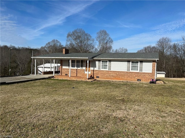 view of front of property featuring an attached carport, crawl space, and a front yard