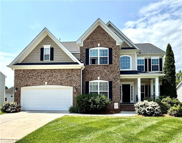 3918 Stafford Run Ct, High Point, NC 27265 - craftsman-style home with concrete driveway, a front lawn, and brick siding