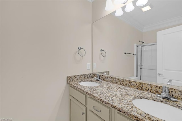 bathroom featuring vanity, an enclosed shower, and ornamental molding