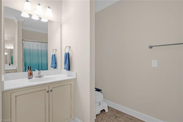 bathroom featuring tile patterned flooring, vanity, toilet, and ornamental molding