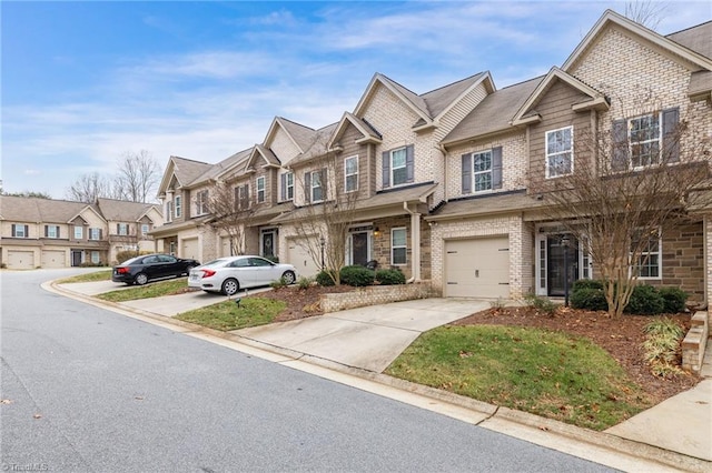 townhome / multi-family property featuring a garage