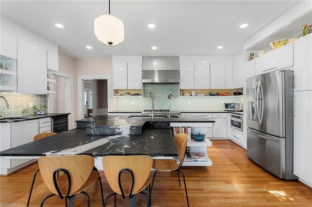 3054 Country Club Rd, Winston-Salem, NC 27104 - kitchen with stainless steel refrigerator with ice dispenser, modern cabinets, open shelves, wall chimney range hood, and oven