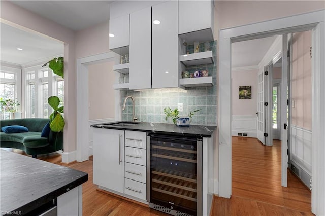 3054 Country Club Rd, Winston-Salem, NC 27104 - indoor bar featuring wine cooler, crown molding, backsplash, light wood-style flooring, and recessed lighting
