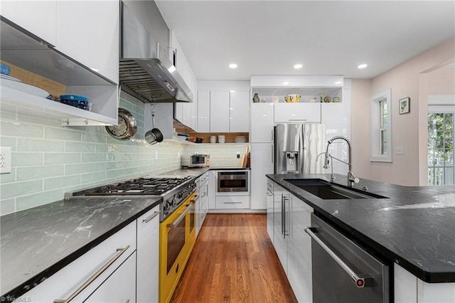 3054 Country Club Rd, Winston-Salem, NC 27104 - kitchen featuring stainless steel appliances, wall chimney range hood, open shelves, a sink, and modern cabinets